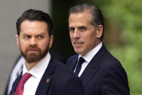 Hunter Biden, right, departs from federal court, Monday, June 10, 2024, in Wilmington, Del. (AP Photo/Matt Slocum)