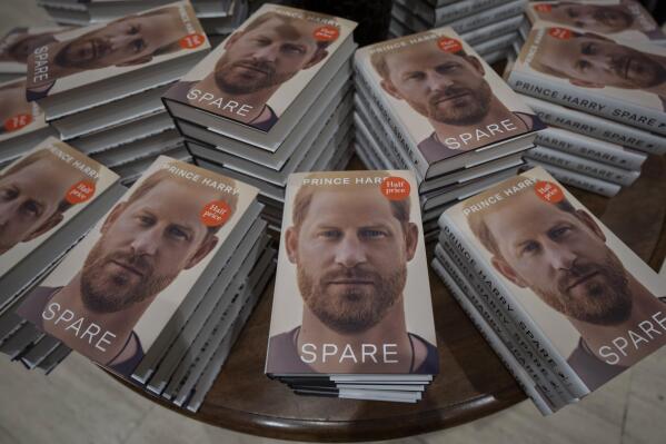 FILE - Copies of the new book by Prince Harry called "Spare" are displayed at a book store in London, Jan. 10, 2023. Prince Harry’s explosive memoir, with its damning allegations of a toxic relationship between the monarchy and the press, is likely to accelerate the pace of change already under way within the House of Windsor following the death of Queen Elizabeth II. (AP Photo/Kin Cheung, File)