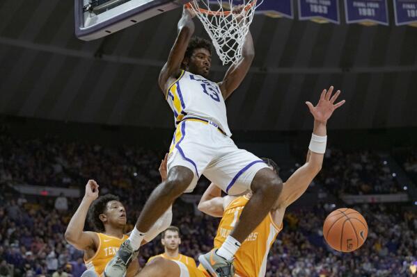 LSU forward Tari Eason (13) dunks against Tennessee forward Olivier Nkamhoua, left, and guard Kennedy Chandler (1) during the second half of an NCAA college basketball game in Baton Rouge, La., Saturday, Jan. 8, 2022. (AP Photo/Matthew Hinton)