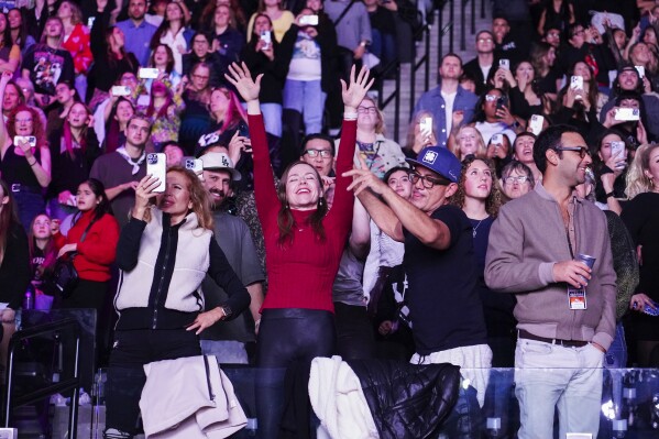 Audience members watch Katy Perry perform during the FireAid benefit concert on Thursday, Jan. 30, 2025, at Intuit Dome in Inglewood, Calif. (Photo by Jordan Strauss/Invision/AP)