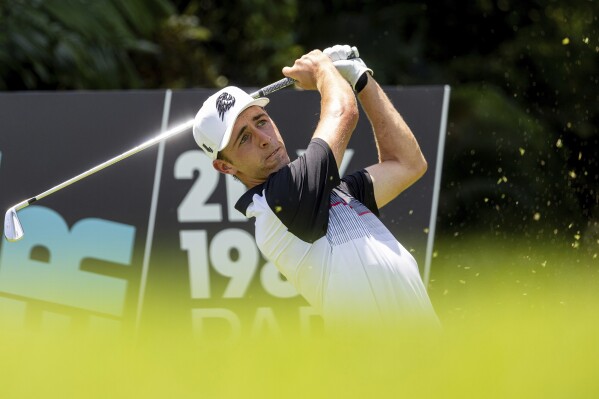 David Puig of Fireballs GC hits his shot from the eighth tee during the first round of LIV Golf Singapore at Sentosa Golf Club in Sentosa, Singapore, Friday, May 3, 2024. (Chris Trotman/LIV Golf via AP)