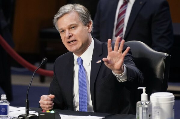 FBI Director Christopher Wray testifies before the Senate Judiciary Committee on Capitol Hill in Washington, Tuesday, March 2, 2021. Wray is condemning the Jan. 6 riot at the Capitol as “domestic terrorism.”  (AP Photo/Patrick Semansky)