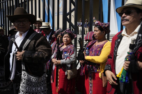 FILE - Indigenous protestors demand the resignation of Attorney General Consuelo Porras and prosecutor Rafael Curruchiche in Guatemala City, Oct. 2, 2023. (AP Photo/Moises Castillo, File)