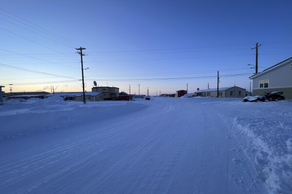 The sun sets in the northwest Alaska village of Point Hope, on the Chukchi Sea on Feb. 21, 2024. A fatal shooting at a home in a remote Inupiat whaling village on Alaska's northwest coast on Sunday, Feb. 25, 2024, shook the small community in Point Hope. (Ka'ainoa Ravey via AP)