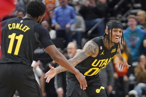 Utah Jazz's Jordan Clarkson (00) celebrates after making a 3-pointer with teammate Mike Conley (11) during the first half of an NBA basketball game against the Houston Rockets Wednesday, Oct. 26, 2022, Salt Lake City. (AP Photo/Rick Bowmer)