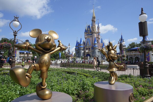 FILE - The Cinderella Castle is seen at the Magic Kingdom at Walt Disney World, July 14, 2023, in Lake Buena Vista, Fla. Months after Disney and Florida Gov. Ron DeSantis' appointees agreed to end a protracted legal fight, the two sides are set to approve an agreement Wednesday, June 5, 2024, that could result in the company investing $17 billion into its Florida resort and opens the door to a fifth major theme park at Walt Disney World. (AP Photo/John Raoux, File)