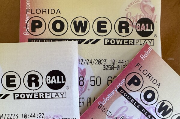 FILE - Powerball lottery tickets are displayed Oct. 4, 2023, in Surfside, Fla. Someone in Michigan has won an $842.4 million Powerball jackpot on the first day of 2024, the first time it has been won on New Year’s Day since the game’s start in 1992. (AP Photo/Wilfredo Lee, File)