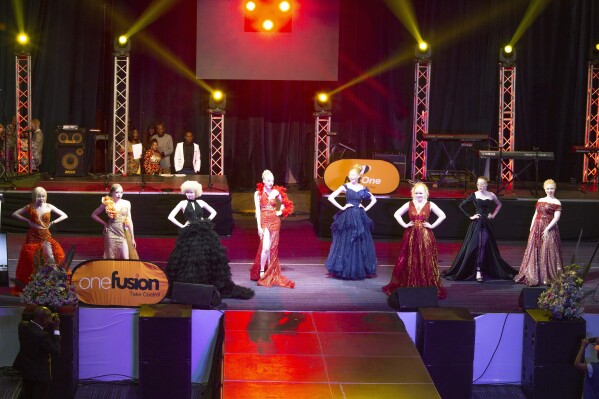 In this photo supplied by pageant organiser John Karimazonde of the Mr and Miss Albinism Southern Africa Pageant, contestants take part in the pageant at the Harare International Conference Centre, Saturday Oct. 14, 2023. (Watson Ofumeli/Mr and Miss Albinism Southern Africa Pageant via AP)