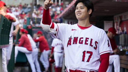 Los Angeles Angels designated hitter Shohei Ohtani (17) greets a teammate in the dugout during the first inning of a baseball game against the Arizona Diamondbacks in Anaheim, Calif., Friday, June 30, 2023. (AP Photo/Ashley Landis)