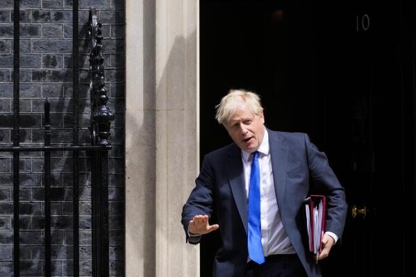 British Prime Minister Boris Johnson leaves 10 Downing Street in London, Wednesday, July 6, 2022. A defiant British Prime Minister Boris Johnson is battling to stay in power after his government was rocked by the resignation of two top ministers. His first challenge is getting through Wednesday, where he faces tough questions at the weekly Prime Minister's Questions session in Parliament, and a long-scheduled grilling by a committee of senior lawmakers. (AP Photo/Frank Augstein)