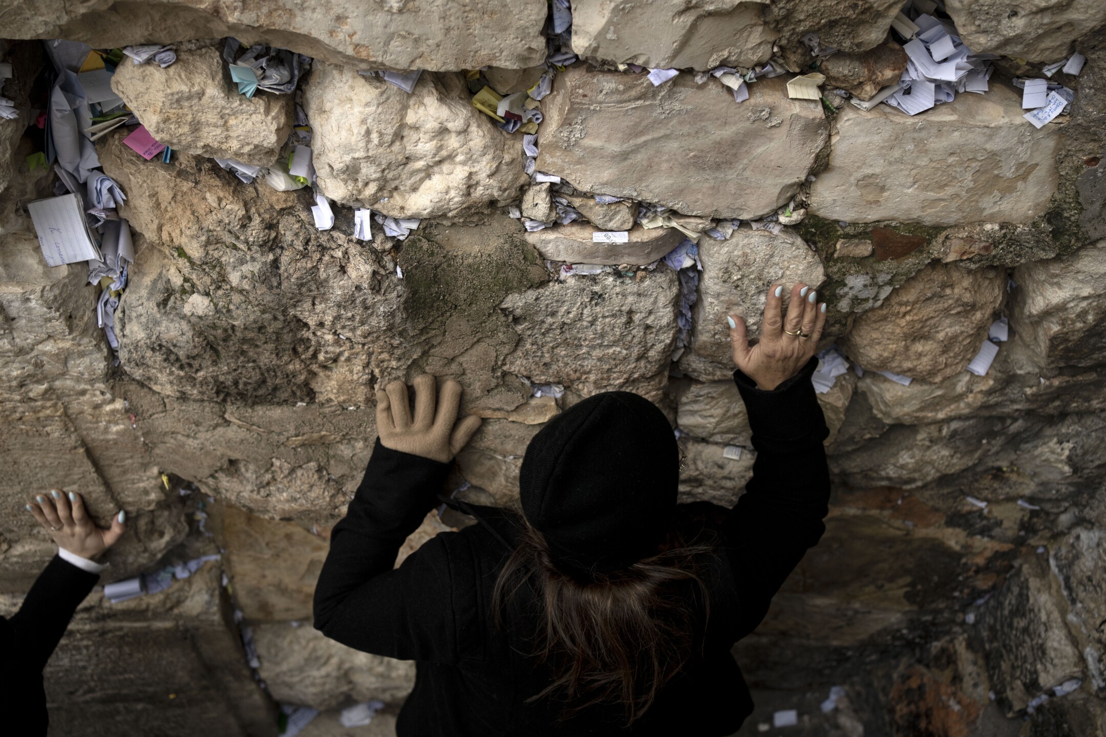 Worshippers visit the women's section of the Western Wall, the holiest site where Jews can pray, in the Old City of Jerusalem, on Feb. 9, 2023. (AP Photo/Maya Alleruzzo)