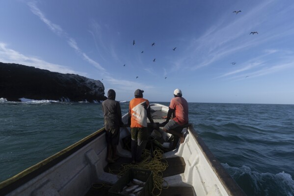 Fishers look for a spot to collect their catch in Cabo de la Vela, Colombia, Feb. 7, 2025. (AP Photo/Ivan Valencia, File)