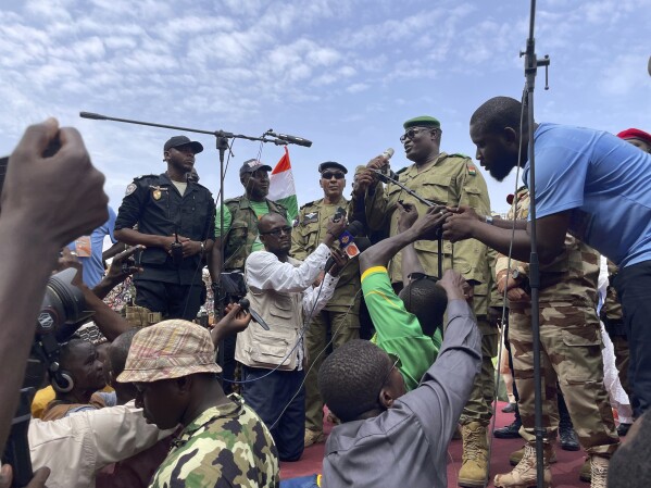 FILE - Mohamed Toumba, one of the soldiers who ousted Nigerian President Mohamed Bazoum, addresses supporters of Niger's ruling junta in Niamey, Niger, Sunday, Aug. 6, 2023. The U.S. is making precautionary plans to evacuate two key drone and counter-terror bases in Niger if that becomes necessary under the West African nation’s new ruling junta. That word came Friday, Aug. 18, from the Air Force commander for Africa, Gen. James Hecker. The Air Force general stressed to reporters in Washington that there had been no U.S. decision to evacuate Niger, which has been the United States' top counter-terror outpost in West Africa's Sahara and Sahel regions. (AP Photo/Sam Mednick, File)