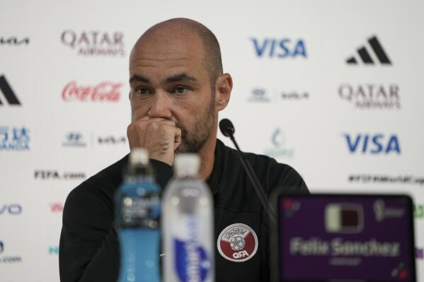 Qatar's head coach Felix Sanchez listens to a question during a press conference, in Doha, Qatar, Saturday, Nov. 19, 2022 . Qatar will play in the opening match against Ecuador on Sunday. (AP Photo/Ariel Schalit)