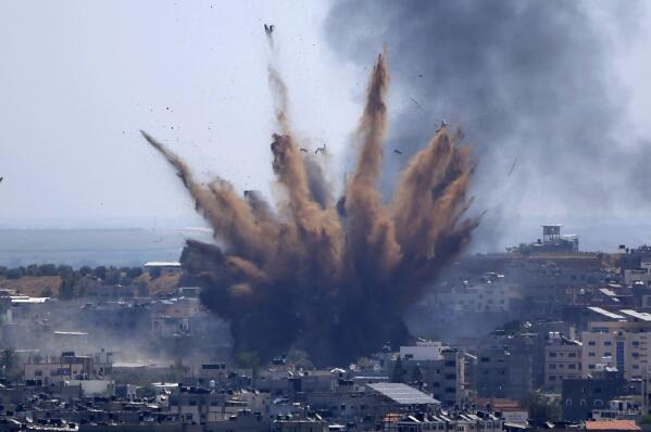 Smoke rises following Israeli airstrikes on a building in Gaza City, Thursday, May 13, 2021. (AP Photo/Hatem Moussa)