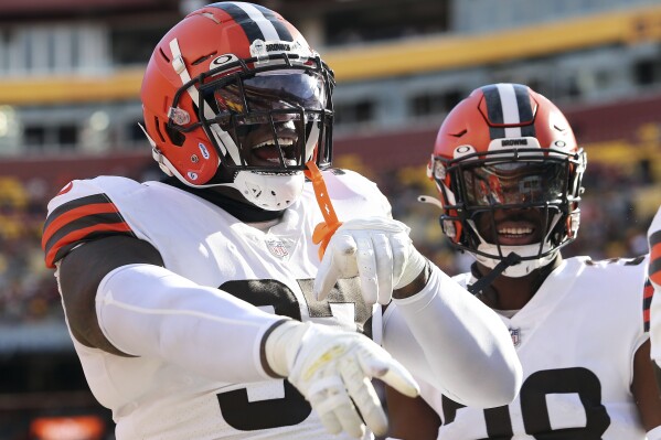 FILE - Cleveland Browns defensive tackle Perrion Winfrey (97) celebrates during an NFL football game against the Washington Commanders, Sunday, Jan. 1, 2023 in Landover, Md. The New York Jets signed defensive tackle Perrion Winfrey, who was released by Cleveland in July following some legal issues, to the practice squad.(AP Photo/Daniel Kucin Jr., File)