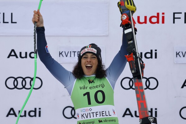 Italy's Federica Brignone celebrates winning an alpine ski, women's World Cup super-G race, in Kvitfjell, Norway, Sunday, March 3, 2024. (AP Photo/Alessandro Trovati)