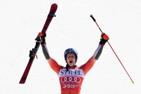 Marco Odermatt, of Switzerland, celebrates his victory in men's World Cup giant slalom skiing race Saturday, Feb. 24, 2024, at Palisades Tahoe ski resort in Olympic Valley, Calif. (AP Photo/Robert F. Bukaty)