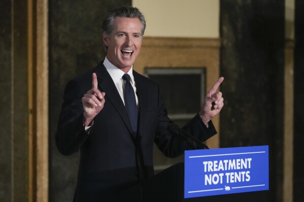 FILE - California Gov. Gavin Newsom speaks about mental health crisis before signing off on two major pieces of legislation to transform the state's mental health system and to address the state's worsening homelessness crisis in Los Angeles, on Oct. 12, 2023. Roughly 100 petitions to fast-track people with untreated schizophrenia and other psychotic disorders into housing and medical care under an alternative mental health court program created by Newsom have been submitted in seven California counties as of Dec. 1, 2023. (AP Photo/Damian Dovarganes, File)