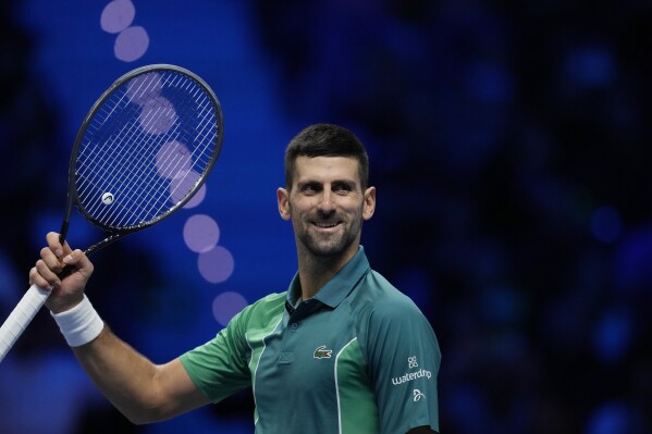 Serbia's Novak Djokovic celebrates after winning the singles tennis match against Denmark's Holger Rune, of the ATP World Tour Finals at the Pala Alpitour, in Turin, Italy, Monday, Nov. 13, 2023. (AP Photo/Antonio Calanni)