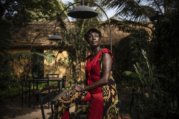 Burkinabe actress Maimouna Ndiaye poses for a photo after an interview in Ouagadougou, Burkina Faso, Tuesday, Feb. 21, 2023. "We only have FESPACO left to prevent us from thinking about what's going on," said Ndiaye, who has four submissions in this year's competition. "This is the event that must not be cancelled no matter the situation." (AP Photo/Sophie Garcia)