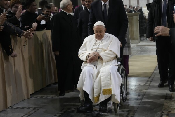 Pope Francis leaves after presiding over the liturgy of the ashes in the Basilica of Santa Sabina in Rome on Ash Wednesday, Feb. 14, 2024. (AP Photo/Gregorio Borgia)