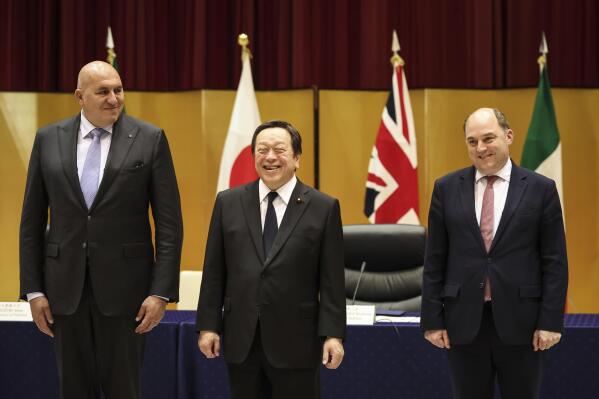 Britain's Defense Minister Ben Wallace, right, Italy's Defense Minister Guido Crosetto, left, and Japan's Defense Minister Yasukazu Hamada pose for a photo before their trilateral meeting Thursday, March 16, 2023 in Tokyo, Japan. (Takashi Aoyama/Pool Photo via AP)