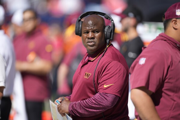 FILE - Washington Commanders offensive coordintor Eric Bieniemy looks on in the first half of an NFL football game Sunday, Sept. 17, 2023, in Denver. UCLA made it official on Saturday, March 2, 2024 announcing Eric Bieniemy is the Bruins' associate head coach and offensive coordinator.(AP Photo/David Zalubowski, File)