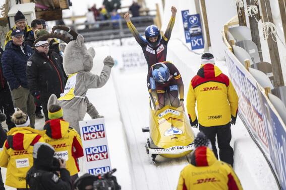 Kim Kalicki and Leonie Fiebig of Germany celebrate during the Women's 2-Bob World Championships in St. Moritz, Switzerland, on Saturday, Feb. 4, 2023. (Mayk Wendt/Keystone via AP)