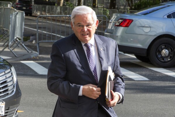 CORRECTS DAY OF WEEK TO TUESDAY INSTEAD OF MONDAY - Sen. Robert Menendez, D-N.J., arrives at federal court, Tuesday, May 28, 2024. Menendez is accused of taking bribes of cash, gold bars and a luxury car in exchange for favors performed for several New Jersey businessmen. (AP Photo/Ted Shaffrey)