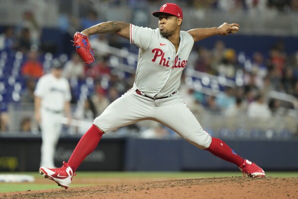 Philadelphia Phillies relief pitcher Gregory Soto aims a pitch during the eighth inning of a baseball game against the Miami Marlins Tuesday, Aug. 1, 2023, in Miami. (AP Photo/Marta Lavandier)