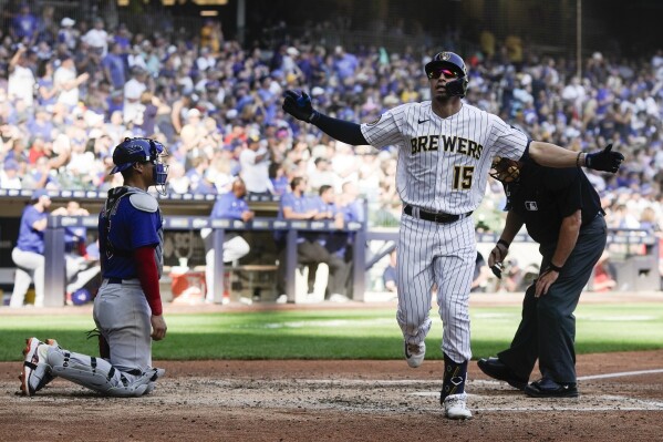 Milwaukee Brewers' Tyrone Taylor reacts after hitting a home run during the sixth inning of a baseball game against the Chicago Cubs Sunday, Oct. 1, 2023, in Milwaukee. (AP Photo/Morry Gash)