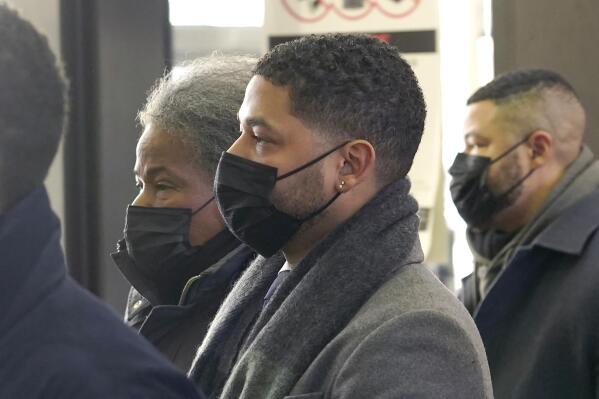 Actor Jussie Smollett arrives with his mother Janet at the Leighton Criminal Courthouse on Wednesday, Dec. 8, 2021, day seven of his trial in Chicago. (AP Photo/Charles Rex Arbogast)