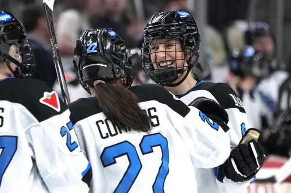 Toronto's Kali Flanagan, right, celebrates her goal with Maggie Connors (22) during the second period of an PWHL hockey game against Montreal in Pittsburgh, Sunday, March 17, 2024. (AP Photo/Gene J. Puskar)