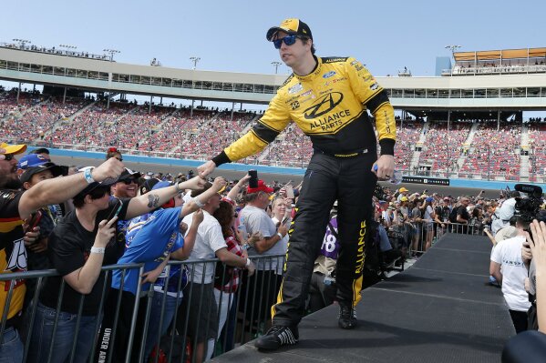 This March 8, 2020 photo shows Brad Keselowski during driver introductions prior to the NASCAR Cup Series auto race at Phoenix Raceway in Avondale, Ariz. Keselowski will start on the pole when the NASCAR season resumes Sunday, May 17, 2020 in Darlington, S.C. The 2012 Cup champion earned the top starting spot through a random draw. (AP Photo/Ralph Freso)