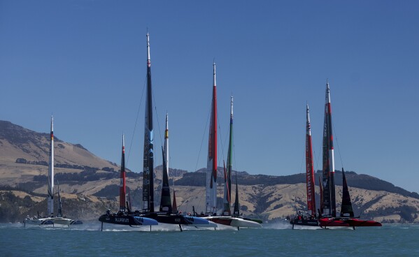 New Zealand SailGP Team helmed by Peter Burling leads the fleet at the start of racing on Race Day 2 of the ITM New Zealand Sail Grand Prix in Christchurch, New Zealand, Sunday, March 24, 2024. (Chloe Knott/SailGP via AP)