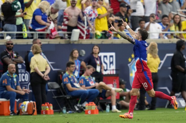 U.S. forward Christian Pulisic (10) celebrates his goal against Brazil on a free kick during the first half of an international friendly soccer match Wednesday, June 12, 2024, in Orlando, Fla. (AP Photo/John Raoux)