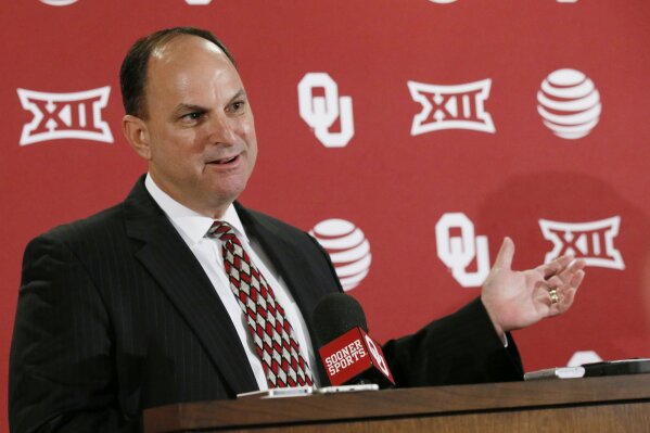 FILE - In this Aug. 29, 2016, file photo, Oklahoma Athletic Director Joe Castiglione gestures as he answers a question during a news conference in Norman, Okla. Whether college football players play a lot in the fall, a little in the spring or not all over the next 10 moths, some athletic administrators want to give them a mulligan on the 2020-21 season. “I think the most forgiving, flexible plan would be the best,” Oklahoma athletic director Joe Castiglione said. (AP Photo/Sue Ogrocki, File)