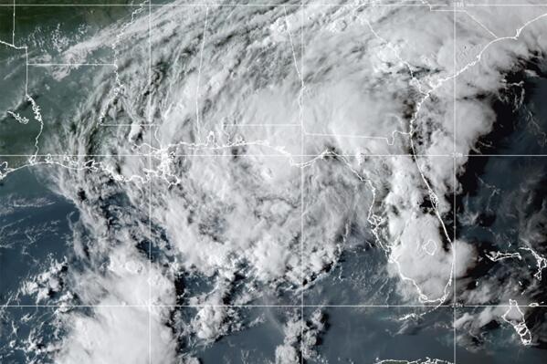 This GOES- East GeoColor satellite image taken Wednesday, Sept. 8, 2021, at 10:30 p.m. EDT., and provided by NOAA, shows Tropical Storm Mindy as it makes landfall on the Florida Panhandle. The storm touched down over St. Vincent Island, about 10 miles (15 km) west southwest of Apalachicola, according to the National Hurricane Center.   (NOAA via AP)