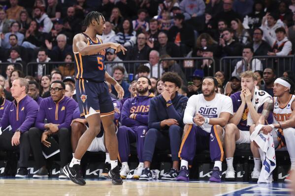 New York Knicks guard Immanuel Quickley (5) reacts after scoring a 3-point basket during the first half of an NBA basketball game against the Phoenix Suns, Monday, Jan. 2, 2023, in New York. (AP Photo/Jessie Alcheh)