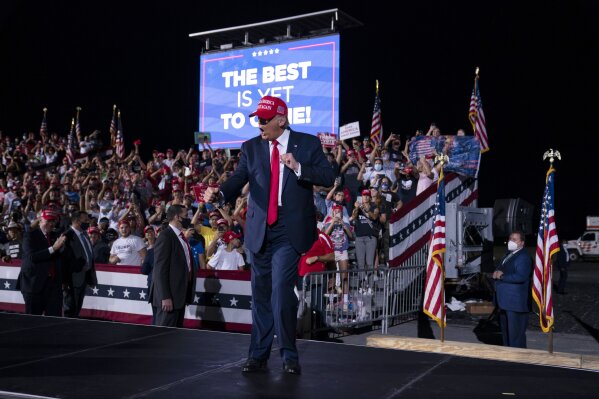 President Donald Trump dances as he walks off stage after speaking during a campaign rally at Miami-Opa-locka Executive Airport, Monday, Nov. 2, 2020, in Opa-locka, Fla. (AP Photo/Evan Vucci)