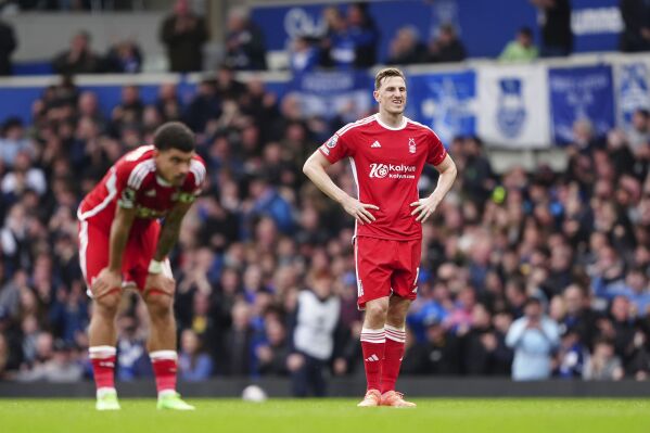 Nottingham Forest's Chris Wood and Nottingham Forest's Morgan Gibbs-White, left, show dejection during the English Premier League soccer match between Everton and Nottingham Forest at Goodison Park, Liverpool, England, Sunday April 21, 2024. (Peter Byrne/PA via AP)