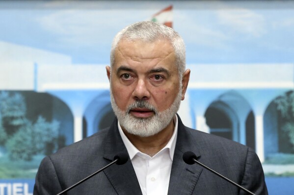 FILE - In this photo released by Lebanese government, Ismail Haniyeh, the leader of the Palestinian militant group Hamas, speaks during a press conference after meeting with Lebanese President Michel Aoun, at the presidential palace, in Baabda, east of Beirut, Lebanon, Monday, June 28, 2021. (Dalati Nohra/Lebanese Official Government via AP, File)