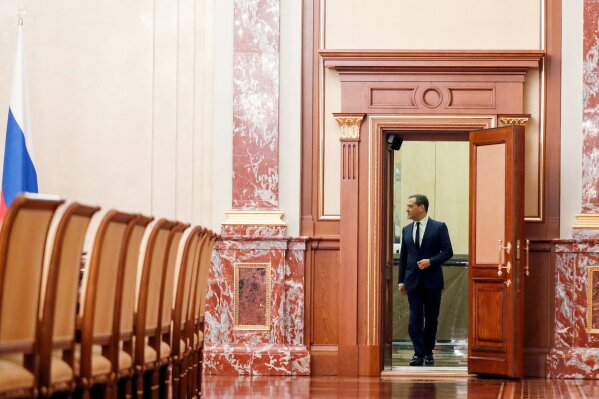 Russian Prime Minister Dmitry Medvedev enters a hall prior to a cabinet meeting in Moscow, Russia, Wednesday, Jan. 15, 2020. The Tass news agency reports Wednesday that Russian Prime Minister Dmitry Medvedev submitted his resignation to President Vladimir Putin. Russian news agencies said Putin thanked Medvedev for his service but noted that the prime minister's Cabinet failed to fulfill all the objectives set for it. (Dmitry Astakhov, Sputnik, Government Pool Photo via AP)