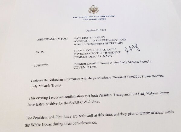 This shows a White House memorandum released Thursday, Oct. 1, 2020 by the Physician to the President, confirming that both President Trump and first lady Melania Trump have tested positive for the SARS-CoV-2 virus. (AP Photo/Wayne Partlow)