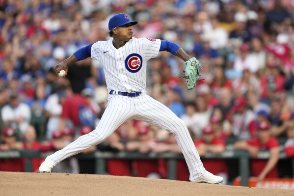 Chicago Cubs starting pitcher Marcus Stroman delivers during the first inning of a baseball game against the Cincinnati Reds Monday, July 31, 2023, in Chicago. (AP Photo/Charles Rex Arbogast)
