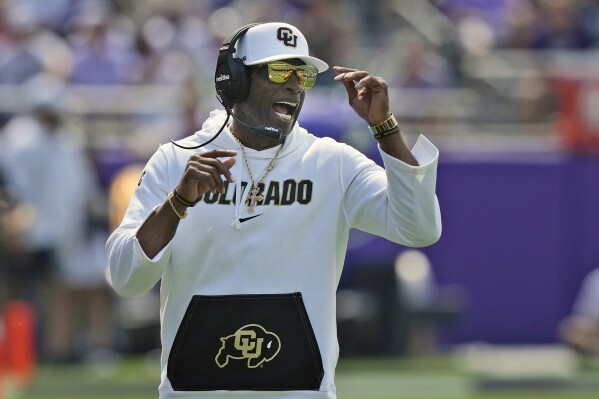 Colorado head coach Deion Sanders yells from the sidelines during the first half of an NCAA college football game against TCU Saturday, Sept. 2, 2023, in Fort Worth, Texas. (AP Photo/LM Otero)
