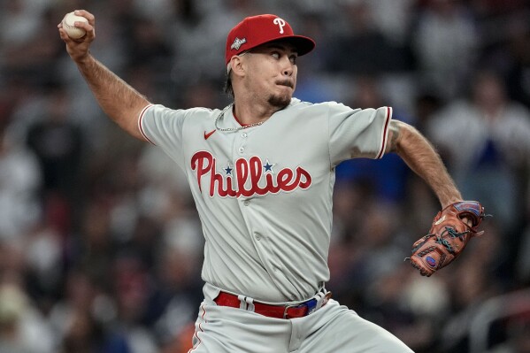Philadelphia Phillies relief pitcher Orion Kerkering (50) works against the Atlanta Braves during the seventh inning of Game 1 of a baseball NL Division Series, Saturday, Oct. 7, 2023, in Atlanta. (AP Photo/John Bazemore)
