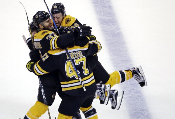 Boston Bruins Forward Patrice Bergeron Raises Stanley Cup Trophy