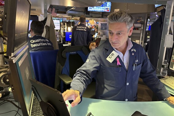File - Traders work on the New York Stock Exchange floor in New York on November 3, 2023. Wall Street is mixed early Friday after closing out the best month of the year. (AP Photo/Ted Shaffrey, File)